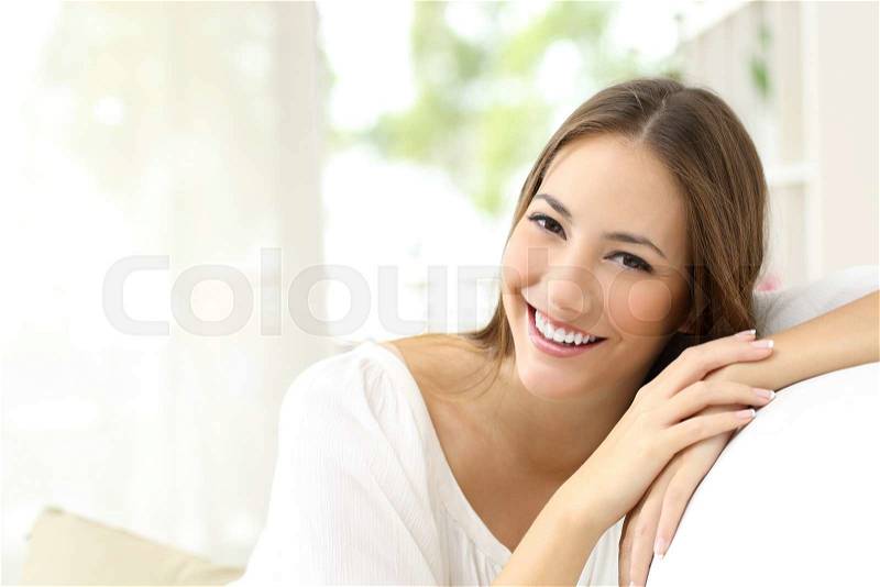 Beauty woman with white perfect smile looking at camera at home, stock photo