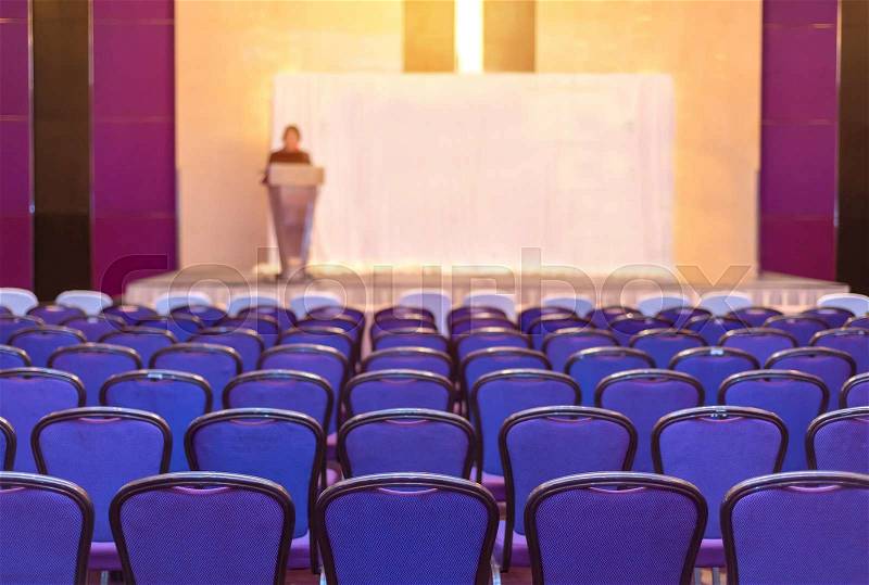 Speaker prepares to lecture but people not interested in listening to lectures, stock photo