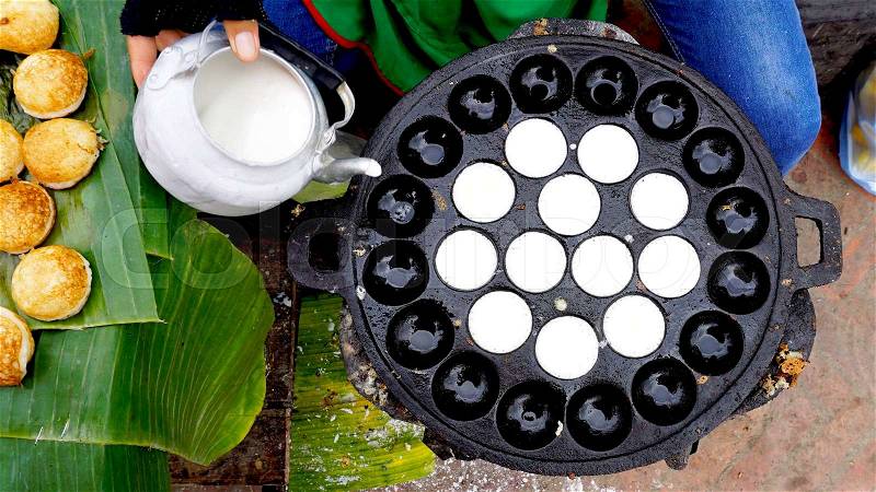 Process of cooking Sweet and Savory Grilled Coconut-Rice Hotcakes, Coconut Rice Cake on banana packaging, Asian dessert, Thai, Thailand, Luang Prabang, Laos, stock photo