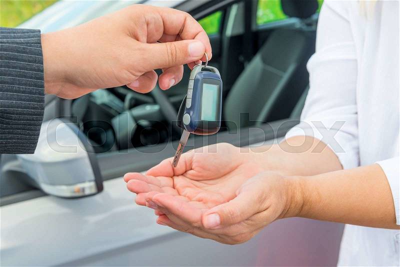 Seller\'s hand with car keys and hands buyer, stock photo