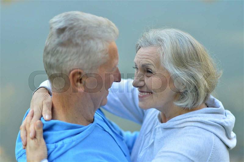 Elderly man and an elderly woman resting together, stock photo