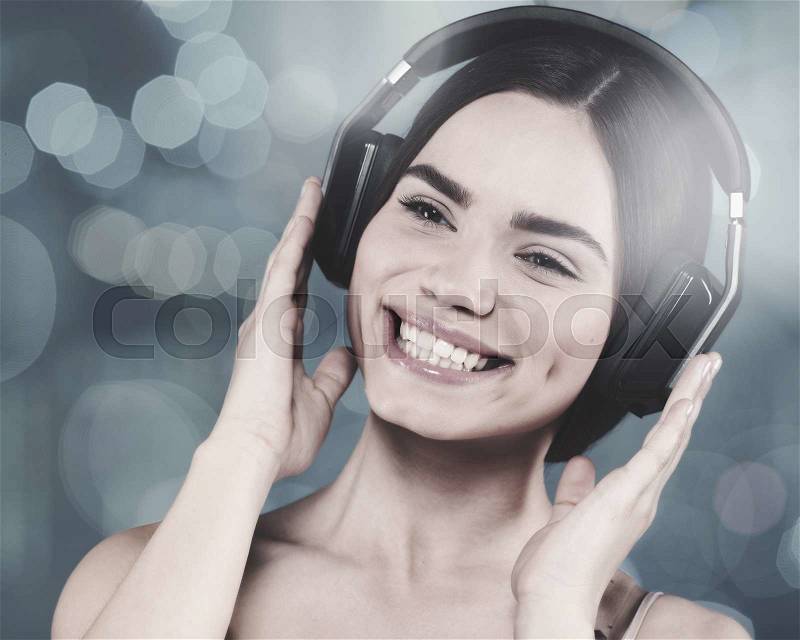 Beauty young girl hearing music with headset, female portrait, stock photo