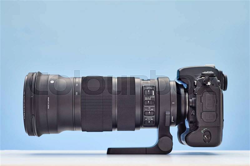 A studio photo of a modern telephoto zoom lens, stock photo