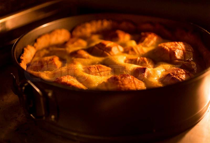 Closeup toned photo of baking traditional apple pie, stock photo
