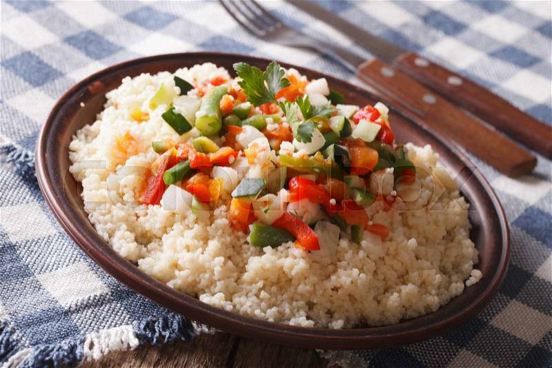 Arabian Food: Cous Cous with vegetables close-up on a plate. horizontal , stock photo