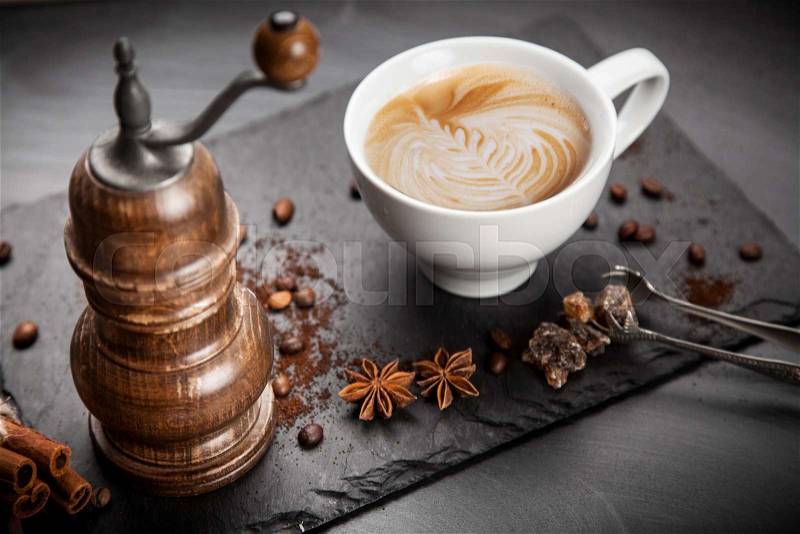Cup of hot coffee on stone board, stock photo