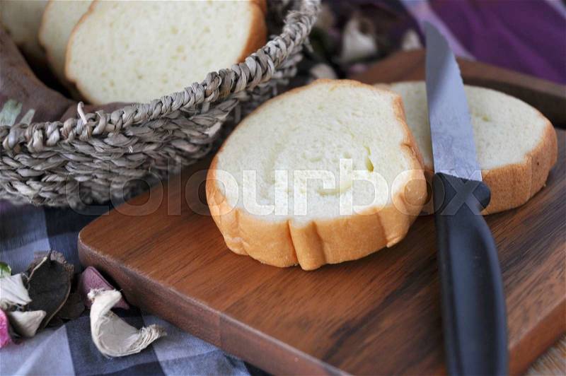 Close up sweet potato bread on cutting board with knife, stock photo
