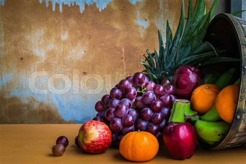 Fruits together on a wooden floor, stock photo
