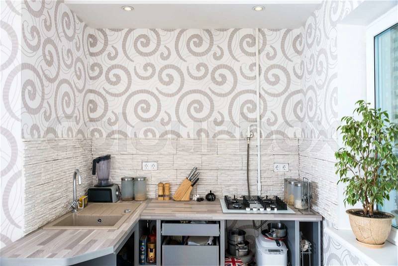 Modern simple kitchen interior design in light apartments, stock photo