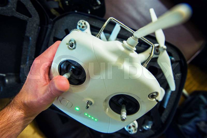Small Drone Remote Preparation. Large Flying Remote Controller and Drone , stock photo