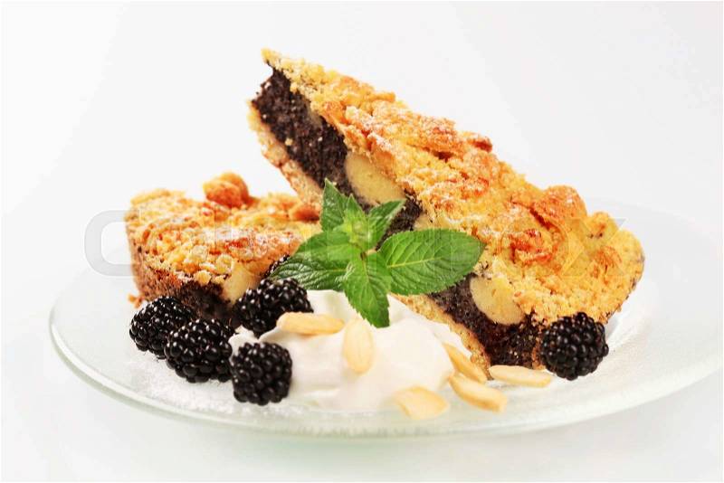 Slices of blackberry cake with crumb topping, stock photo