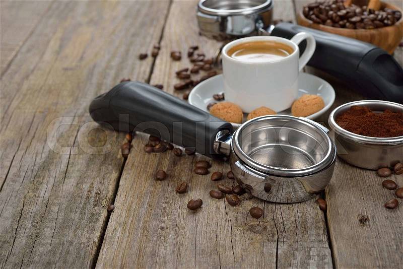 The holder of the coffee machine on a wooden background, stock photo