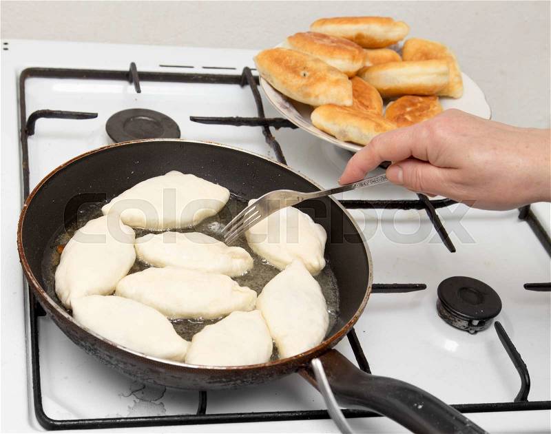 Food patties in a frying pan, stock photo