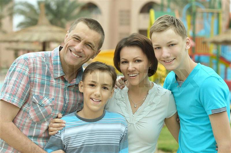 Happy family having fun at tropical resort, stock photo