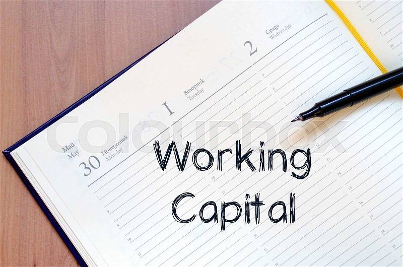 Working capital text concept write on notebook with pen, stock photo