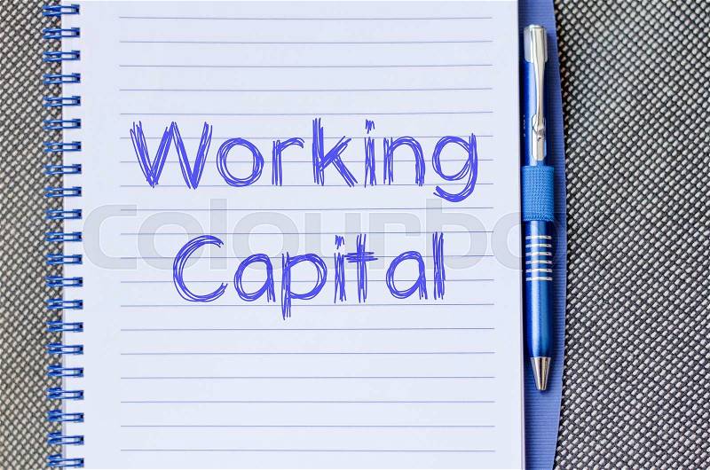 Working capital text concept write on notebook with pen, stock photo