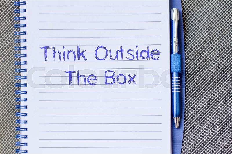 Think outside the box text concept write on notebook with pen, stock photo