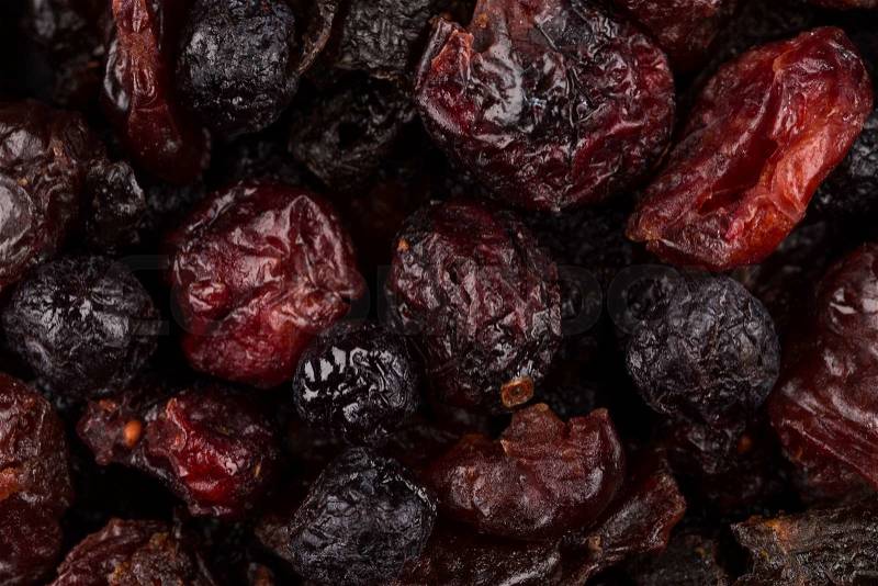 Dried cranberries, cherries and blueberries as a background, stock photo
