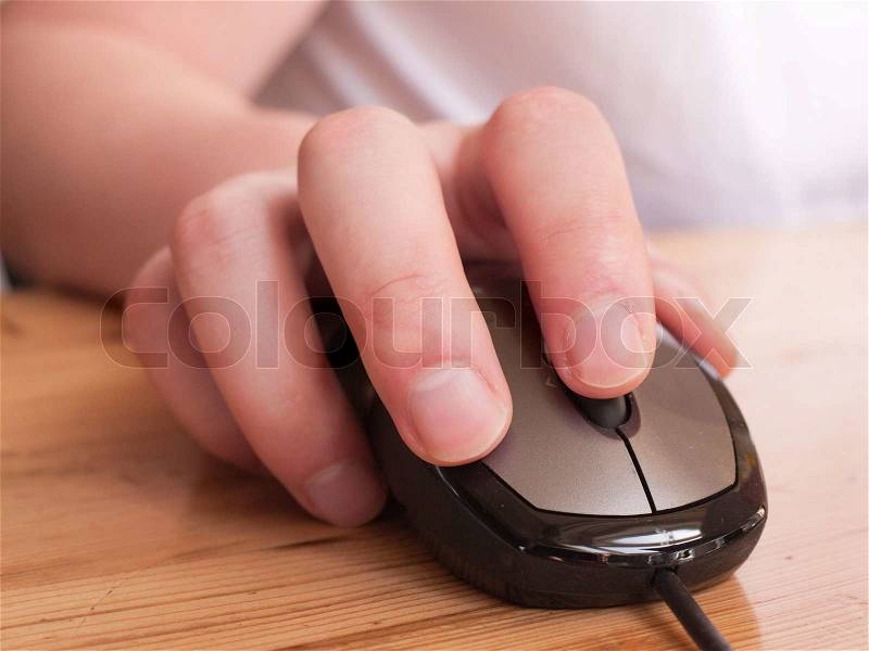 Handling a mouse of a computer, stock photo