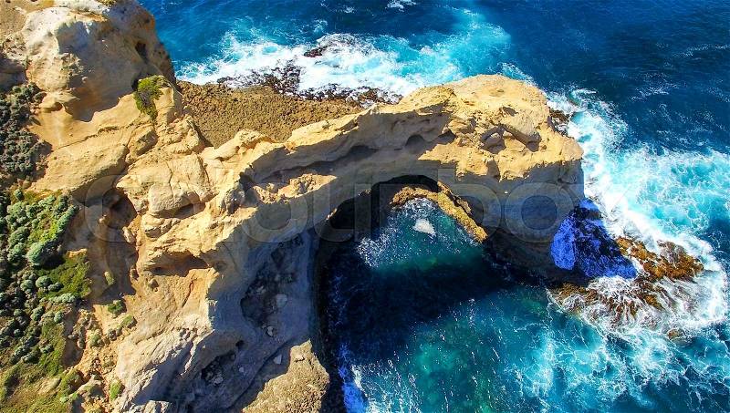 The Arch. Rock formation along Great Ocean Road, Australia. Aerial view, stock photo