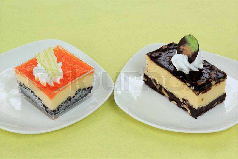 Chocolate Cheesecake and Orange Biscuit cake Layer with cheese cake, stock photo