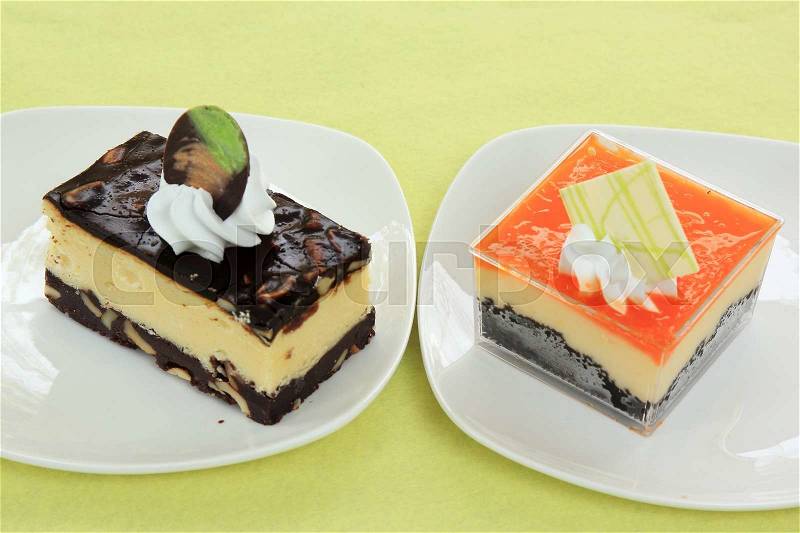 Chocolate Cheesecake and Orange Biscuit cake Layer with cheese cake, stock photo