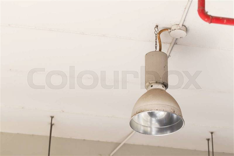 Lamp mounted on the ceiling of the room. Lighting for security in the area, stock photo