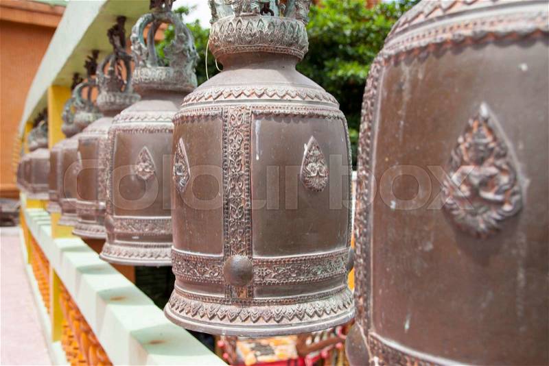 Row of Bronze temple bells at the temple, stock photo