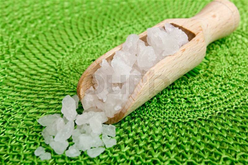 Natural cosmetics salt in a wooden spoon weighed, stock photo