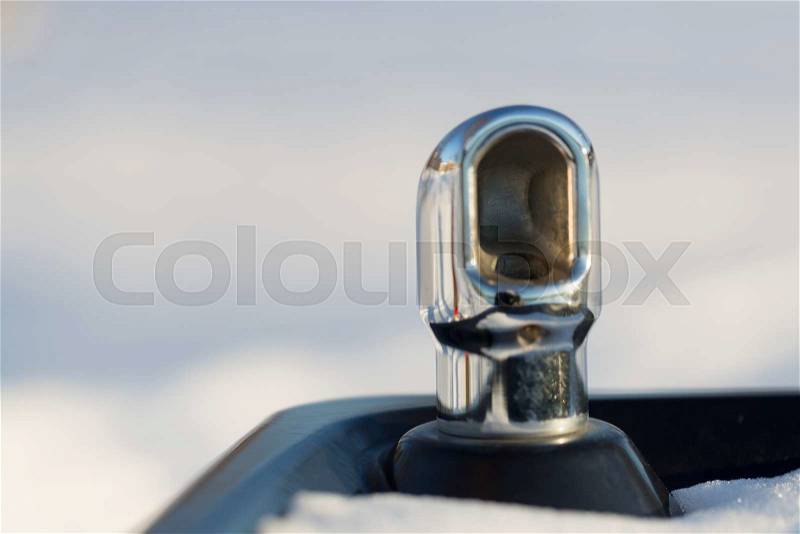 Drinking fountain with Snow and white/grey background, stock photo