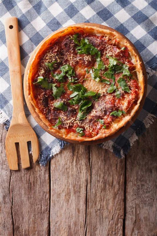 Chicago deep dish pizza on the table. vertical view from above\, stock photo