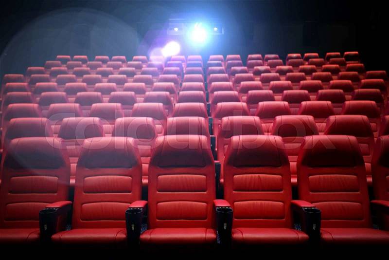 Entertainment and leisure concept - movie theater or cinema empty auditorium with red seats, stock photo