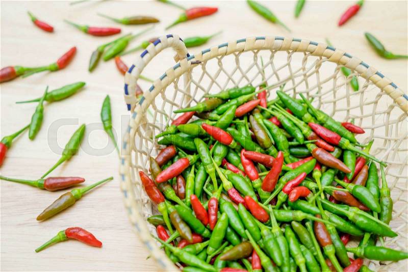 Red and green chili pepper in the besket, stock photo