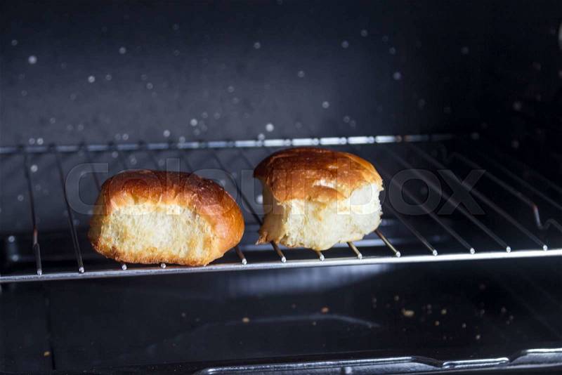 Buns baking in oven, stock photo