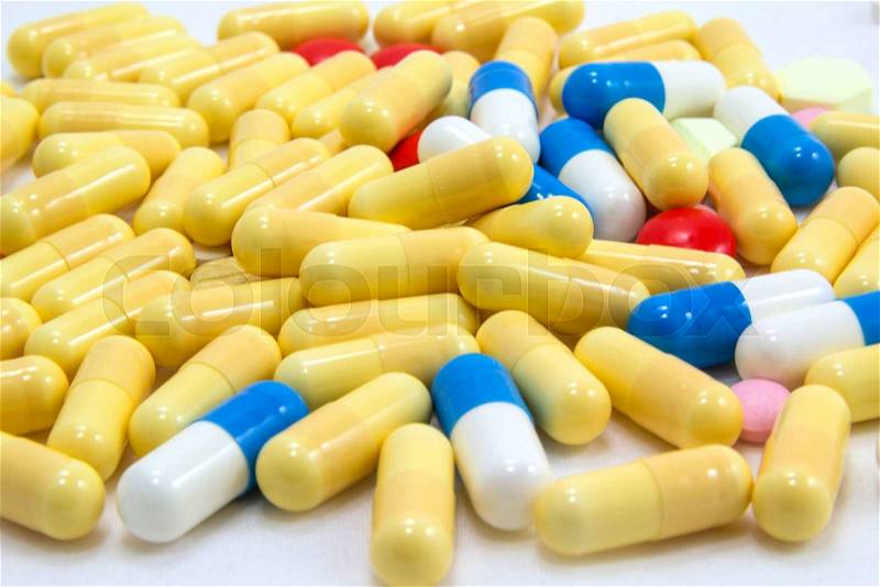 Medicine background of tablets and capsules, stock photo