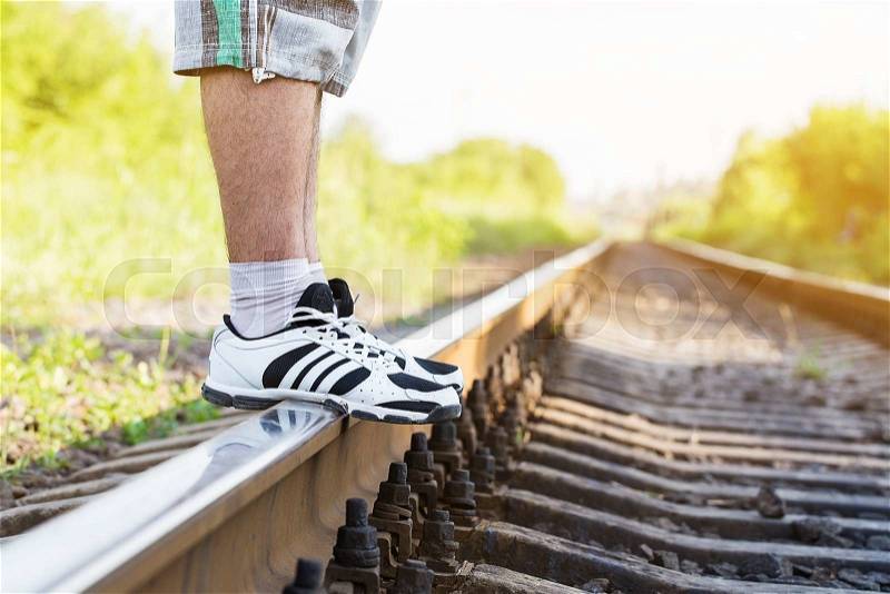 Railroad man legs sunny day, stock photo