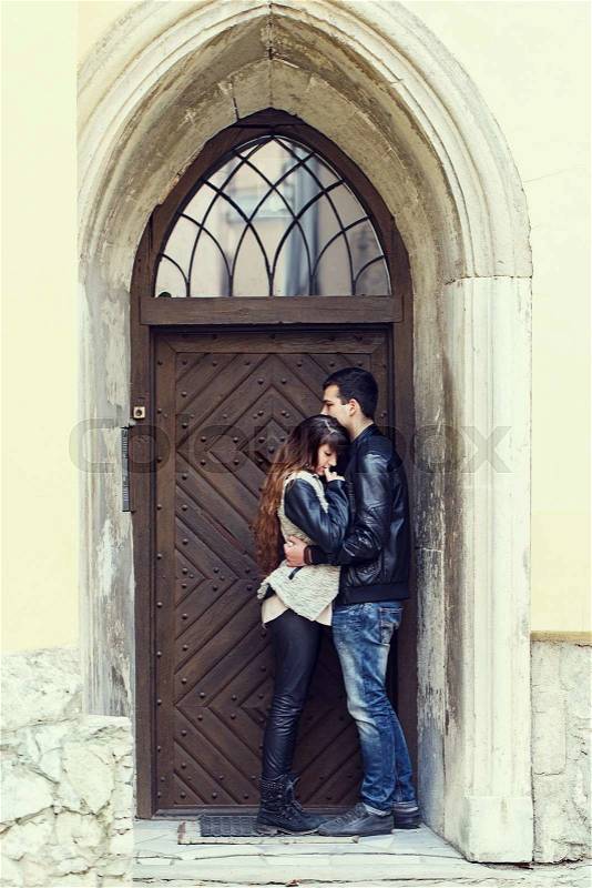 Wooden door retro couple hugging man Woman, stock photo