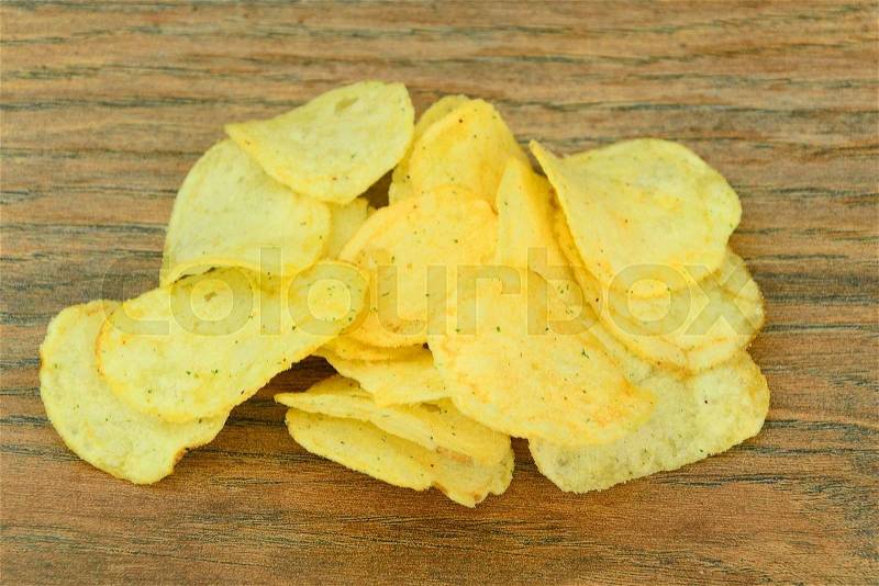 Potato Chips on Wood Background. Studio Photo, stock photo