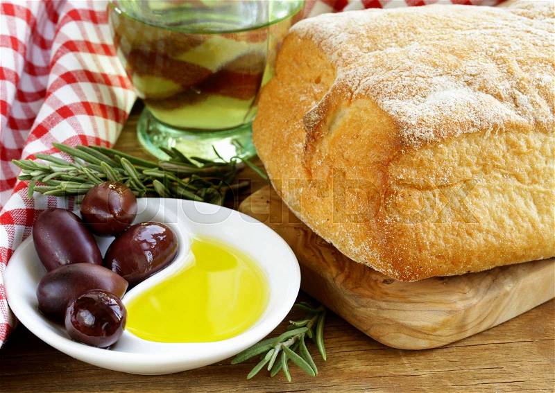 Still life in the Italian style - ciabatta bread, olive and oil, stock photo