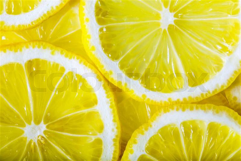 Background made with a heap of sliced lemons , stock photo