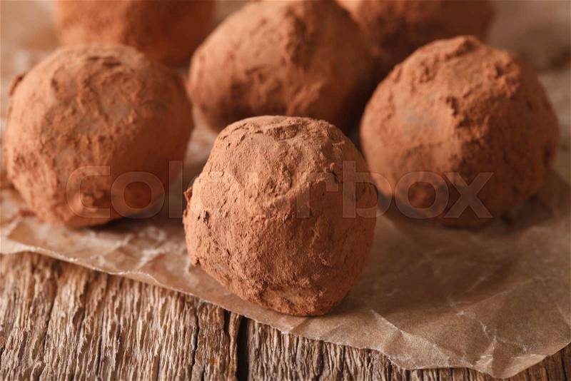 Homemade Chocolate truffles macro on a wooden table in a rustic style. Horizontal , stock photo