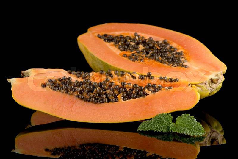 Fresh and tasty papaya on black background, stock photo