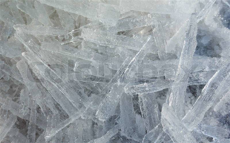 Glacial block of ice with interesting structure crystals macro. Winter background, stock photo