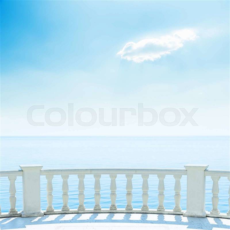 White balcony near sea and blue sky with clouds, stock photo