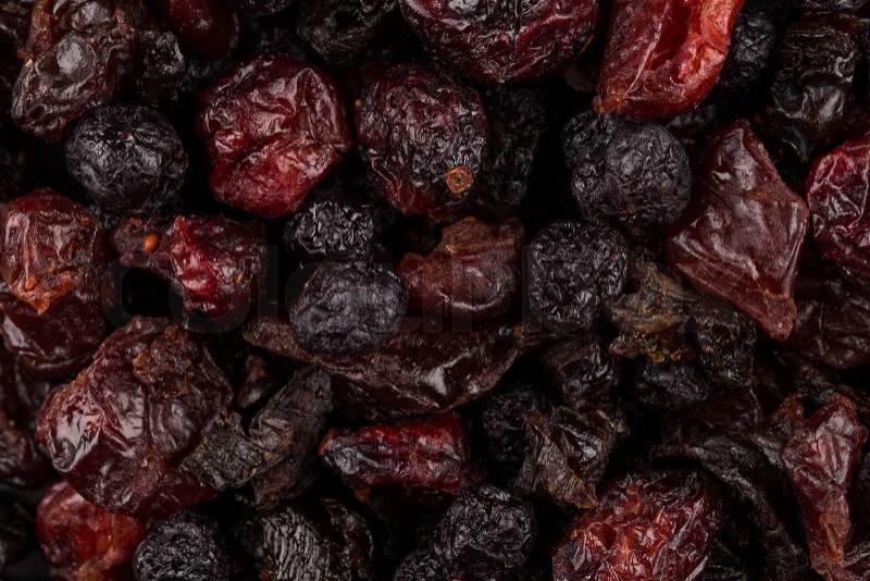 Dried cranberries, cherries and blueberries as a background, stock photo