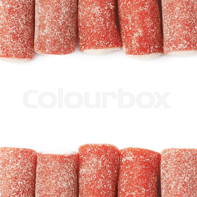 Red and white licorice stick chewing candy isolated over the white background as a backdrop copyspace composition, stock photo