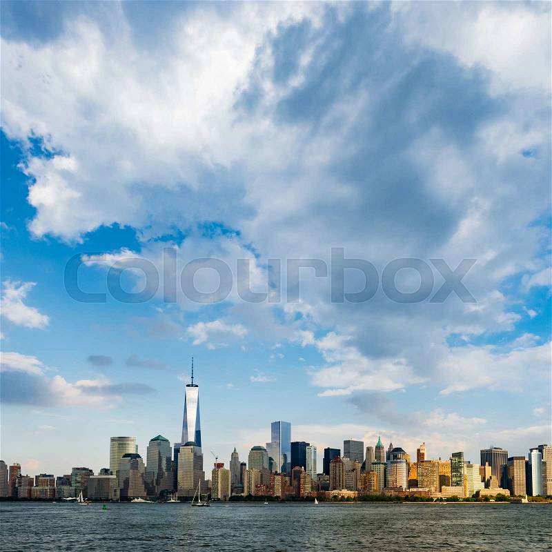 New York City cityscape during day - with blue sky and white clouds, stock photo
