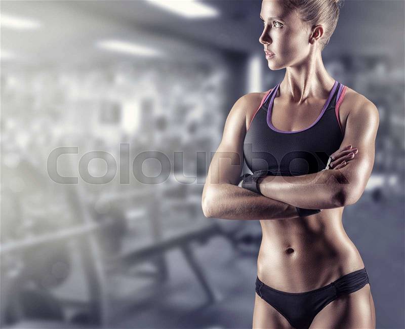 Young beautiful athlete woman in the gym, stock photo