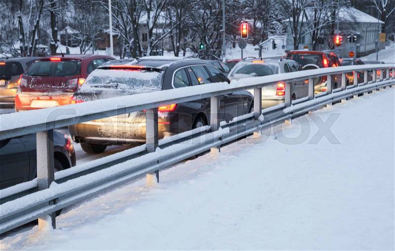 Cars in a traffic jam on winter street in Finland, stock photo
