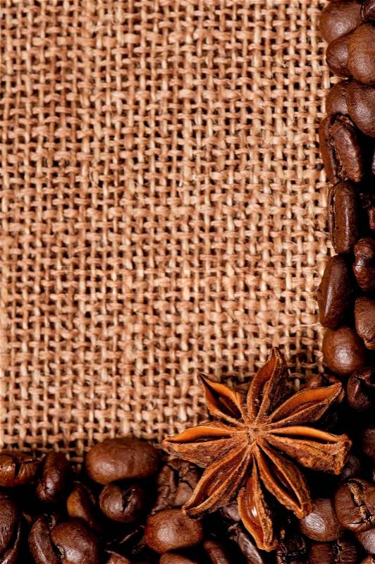 Close-up of coffee beans with spices in burlap sack , stock photo